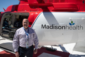 Kevin McEwan, chief nursing officer at MadisonHealth, poses by the new helicopter at Madison Memorial Hospital on Tuesday. | Cody Roberts, EastIdahoNews.com