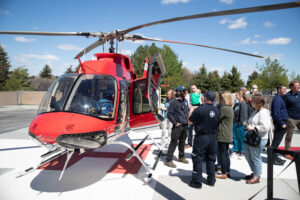 People gather around the new helicopter at Madison Memorial Hospital in Rexburg on Tuesday. | Cody Roberts, EastIdahoNews.com