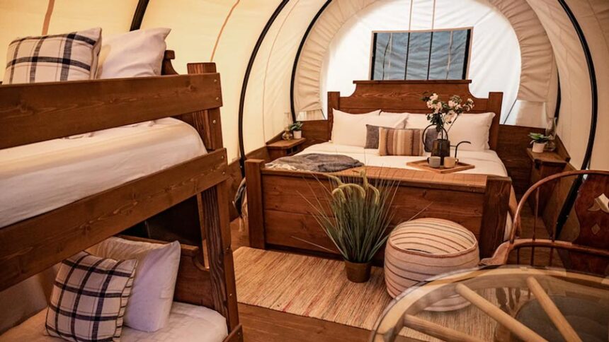 Visitors at North Haven Campground near Bonners Ferry in North Idaho can book a stay in a replica Conestoga Wagon. North Haven was one of 10 “glamping” sites highlighted by The Dyrt, a camping reservation website, as part of its annual Glampy Awards. | The Dyrt