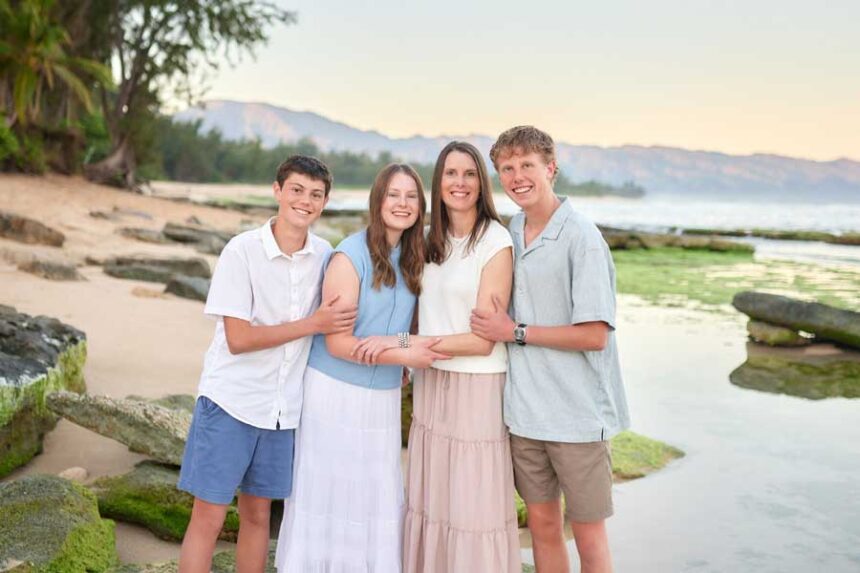 Levi Teemant, 16, left, is pictured with his family. The teenager from Utah recently suffered life-threatening injuries while attempting to film a social media video involving a dangerous activity known as “couch surfing.”
