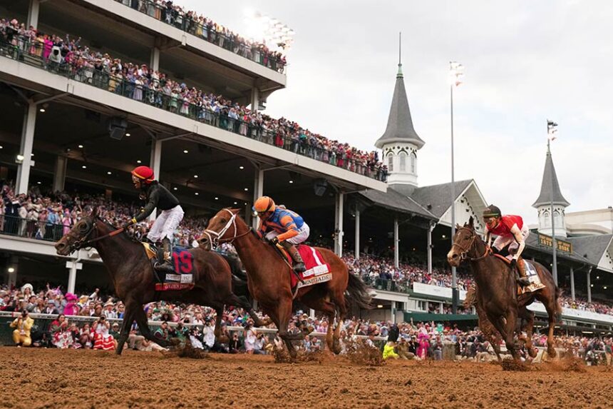THIS STORY ONLY: Jockey Jose L. Ortiz celebrates after riding Golden Tempo (19) to victory the 152nd running of the Kentucky Derby horse race at Churchill Downs on Saturday. | Abbie Parr/AP via CNN Newsource