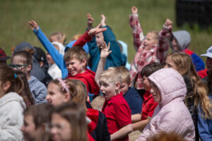 Students at American Heritage Charter School wave at a Black Hawk helicopter as it flies overhead. | Cody Roberts, EastIdahoNews.com