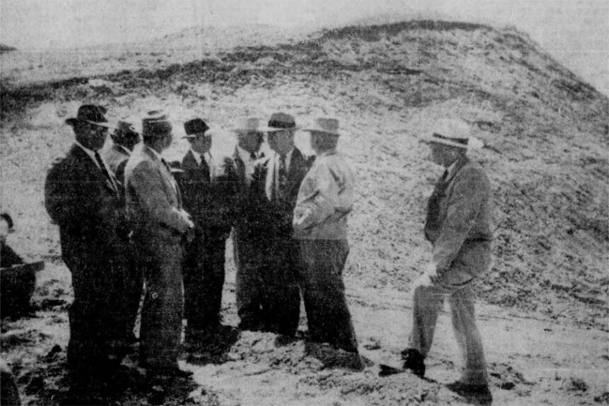 Standing 300 feet above the point where they hope the imposing Palisades dam will some day plug the South Fork of the Snake River are some of the notables who visited the site in connection with the Idaho Reclamation Convention Thursday. Left to right are John Sanborn, former Idaho congressman; M. Westfall, Aberdeen (back to camera); Ival Goslin, Aberdeen; Hamer Budge, Idaho congressman; Ivan Jensen, John R. Murdock (D) Arizona, chairman of the house reclamation committee; I. Donald Jerman, Idaho Falls, engineer of the bureau of reclamation, and Idaho Governor Len Jordan. Caption dated May 25, 1951.