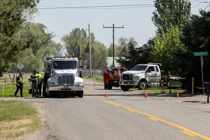 Emergency personnel respond near the scene of a fatal car crash at N. 5th West and 81st North (Riverfront Drive) in Idaho Falls on Friday, May 15, 2026.