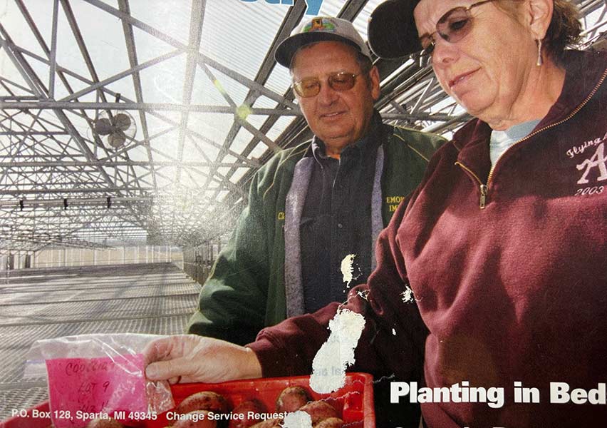 Clen and Emma Atchley working together in their greenhouse. | Courtesy Emma Atchley