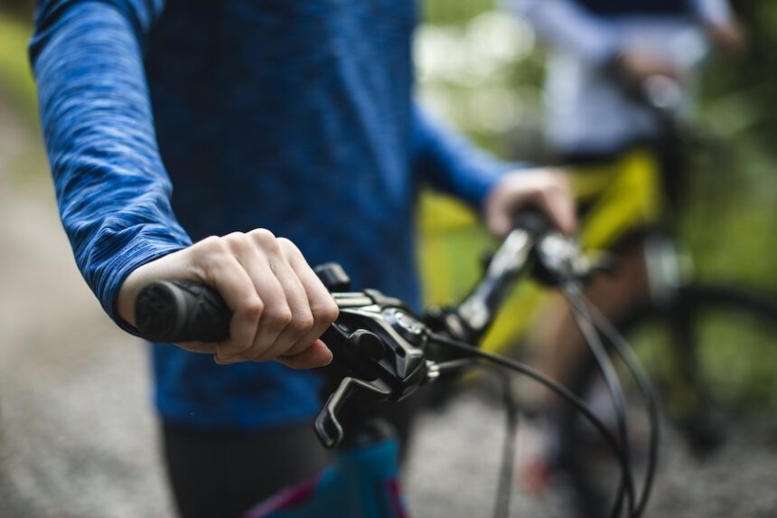 close up of hand gripping bicycle handlebars 2026 03 18 10 58 16 utc