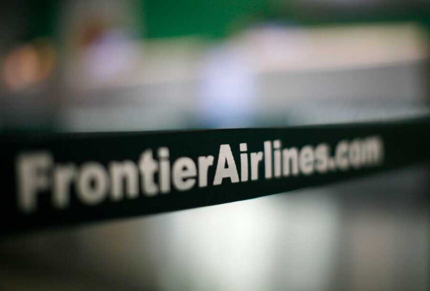A strap guides Frontier Airlines passengers checking in at the Denver airport August 27, 2009. |