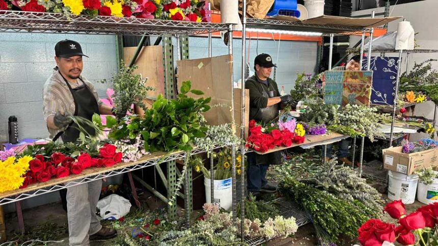 Floral designers arrange bouquets of flowers at the Los Angeles Flower District.