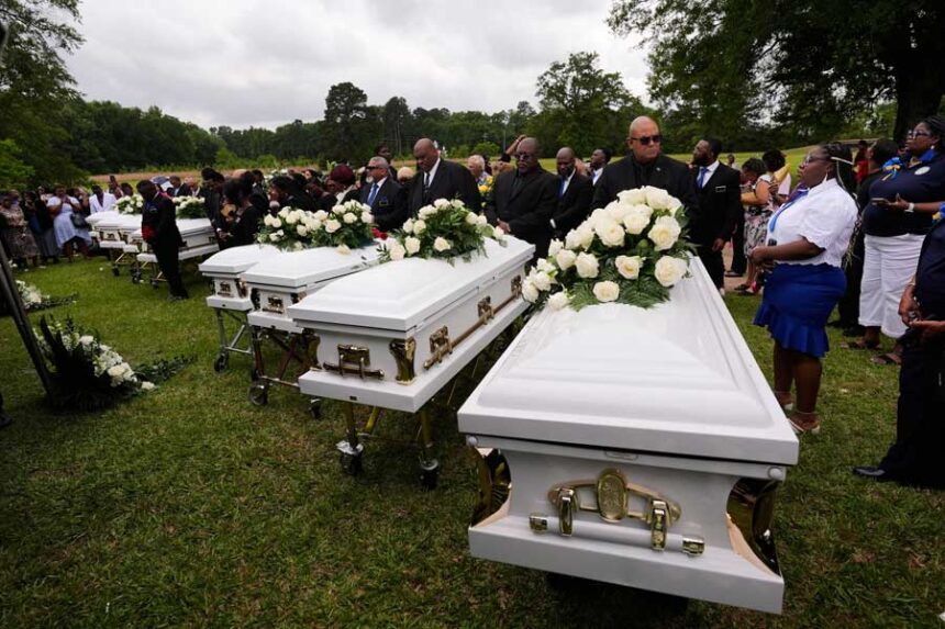 The caskets of the eight children who were killed arrive for burial at Forest Park Cemetery West in Shreveport, Louisiana.