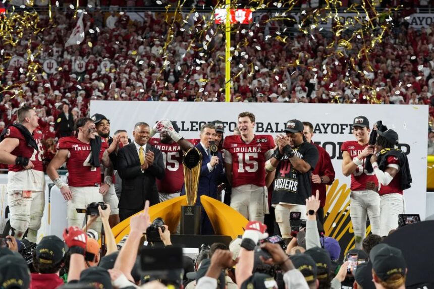 FILE - Indiana quarterback Fernando Mendoza (15) is interviewed during the trophy ceremony after Indiana defeated Miami in a College Football Playoff national championship game, Monday, Jan. 19, 2026, in Miami Gardens, Fla. (AP Photo/Lynne Sladky,File)