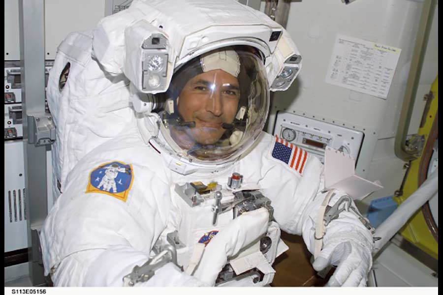 John Herrington wearing the space suit inside the shuttle. | Courtesy John Herrington