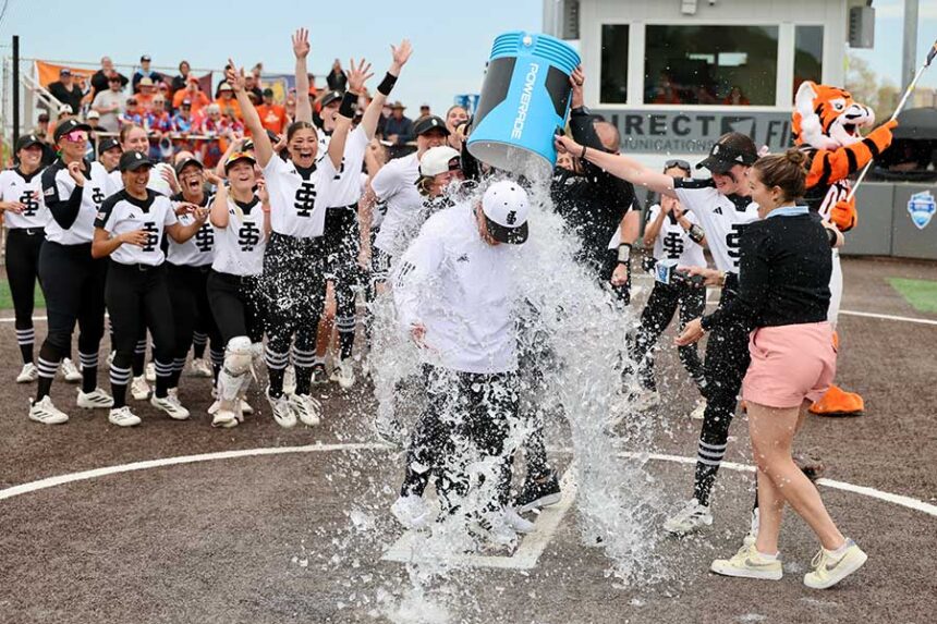 ISU head softball coach Andrew Rich gets an ice bath