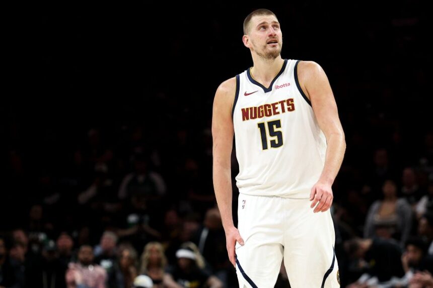 Denver Nuggets center Nikola Jokic (15) looks on during the second half of Game 6 of a first-round NBA basketball playoffs series against the Minnesota Timberwolves, Thursday, April 30, 2026, in Minneapolis. (AP Photo/Matt Krohn)