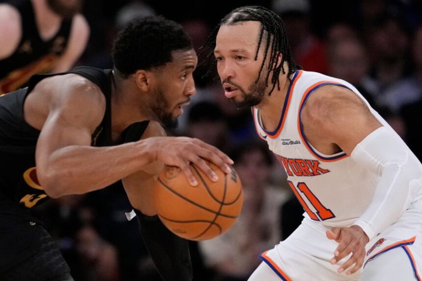 New York Knicks' Jalen Brunson, right, covers Cleveland Cavaliers' Donovan Mitchell, left, during the second half of Game 1 in the Eastern Conference finals NBA basketball playoffs series, Tuesday, May 19, 2026, in New York. (AP Photo/Seth Wenig)
