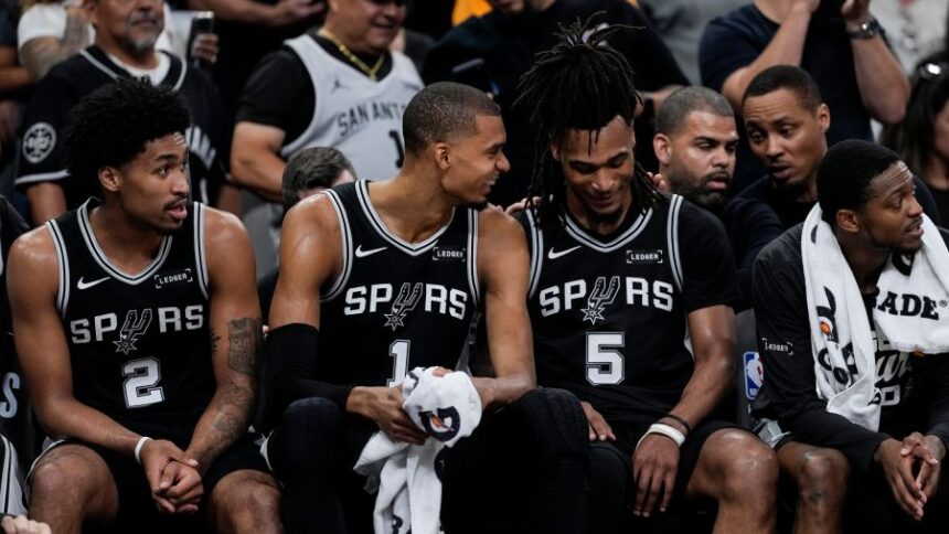 San Antonio Spurs' Victor Wembanyama (1) speaks with Stephon Castle (5) on the bench in the second half of Game 6 in the Western Conference finals NBA basketball playoffs series, Thursday, May 28, 2026, in San Antonio. (AP Photo/David J. Phillip)