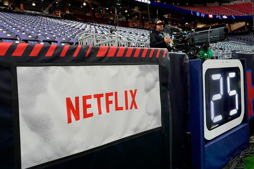 A Netflix banner is seen before an NFL football game between the Houston Texans and the Baltimore Ravens, Dec. 25, 2024, in Houston. (AP Photo/David J. Phillip, File)