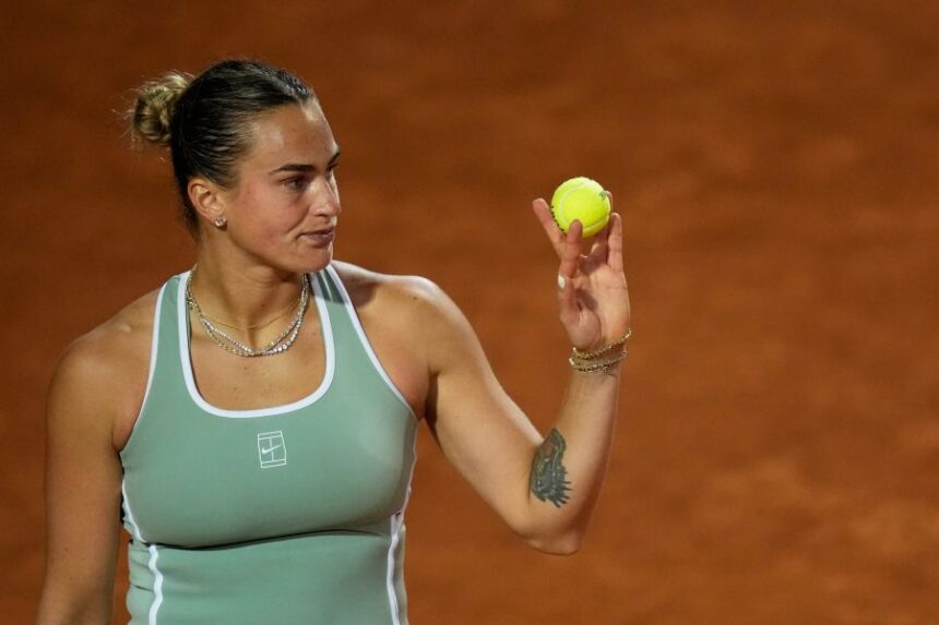 Aryna Sabalenka, of Belarus, prepares to serve the ball to Barbora Krejcikova, of Czechia, during their match at the Italian Open tennis tournament in Rome, Thursday, May 7, 2026. (AP Photo/Alessandra Tarantino)