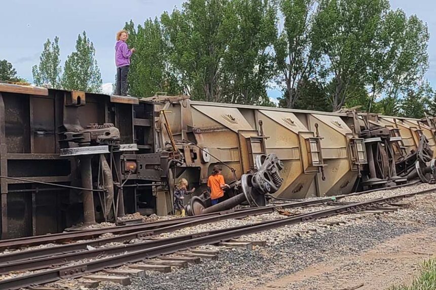 Kids playing on fallen train cars in Ammon Monday afternoon. | Courtesy photo