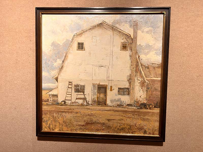 This painting of a white barn is by Allie Zeyer | Rett Nelson, EastIdahoNews.com