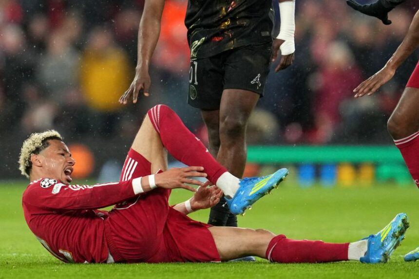Liverpool's Hugo Ekitike reacts after getting injured during the Champions League quarterfinal second leg soccer match between Liverpool and Paris Saint-Germain in Liverpool, England, Tuesday, April 14, 2026. (AP Photo/Jon Super)