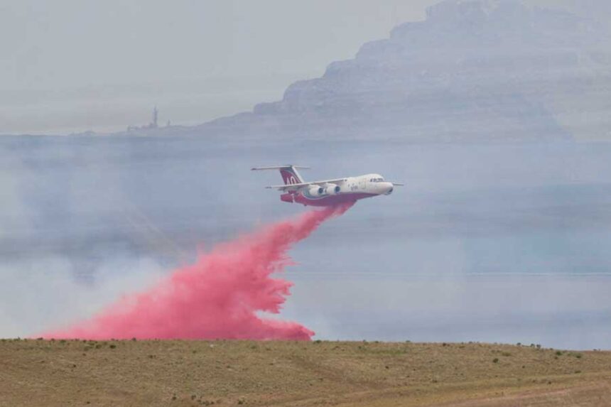 An air tanker drops fire retardant on the Michaud Creek Fire, burning on the Fort Hall Indian Reservation south of Interstate 86 and about 10 miles west of Pocatello, on Saturday, June 5, 2026.