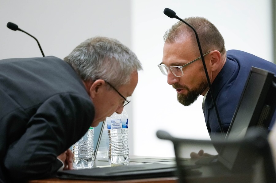 Utah County Attorney Jeff Gray, left, and Deputy Utah County Attorney Ryan McBride talk with each other during a hearing for Tyler Robinson, accused in the fatal shooting of Charlie Kirk, in 4th District Court in Provo, Utah, on Friday, June 12, 2026.