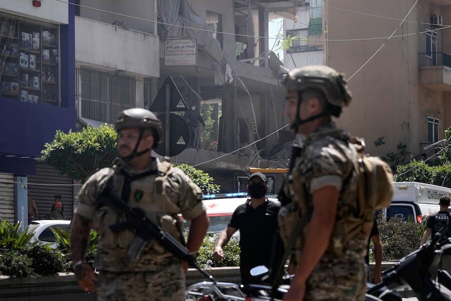 Lebanese soldiers stand guard at the site of an Israeli airstrike that struck an apartment in Dahiyeh, Beirut's southern suburbs, Lebanon, Sunday, June 14, 2026.