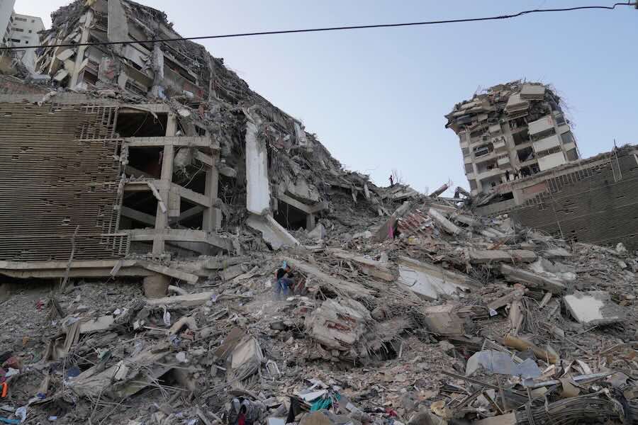 Residents search through the rubble two days after an earthquake struck La Guaira, Venezuela, Friday, June 26, 2026.