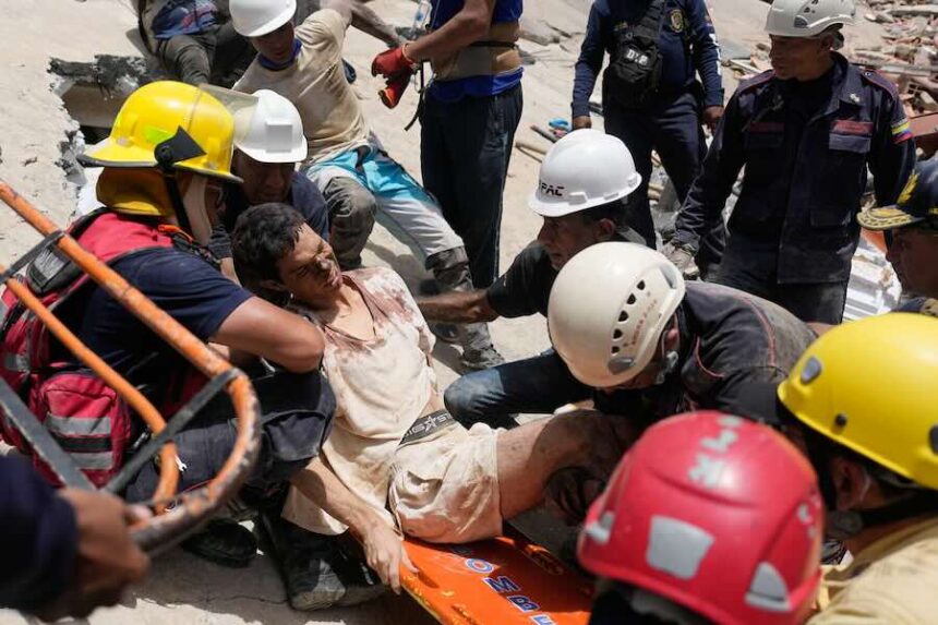 Rescue workers place Daniel Cordero on a stretcher after pulling him from the rubble two days after an earthquake struck Catia la Mar, Venezuela, Friday, June 26, 2026.