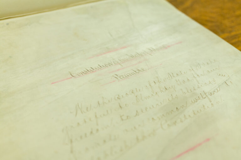 The original copy of the Idaho state Constitution, with bleeding red ink and tattered pages. | Kyle Pfannenstiel, Idaho Capital Sun
