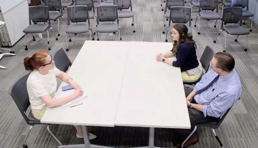 A screenshot from a YouTube video of negotiations in Idaho Falls School District on May 15, 2026, shows union negotiators Megan Stansbury and Jake Snarr, right, talking to attorney Amy White, who is representing the district.