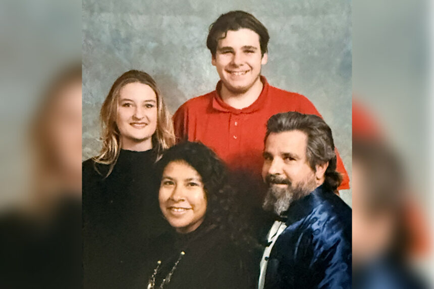 Kynoch Reale-Munroe and Wendell Jenks stand above their step-mother, Laurie Reale and their father, Carta Reale Sierra.