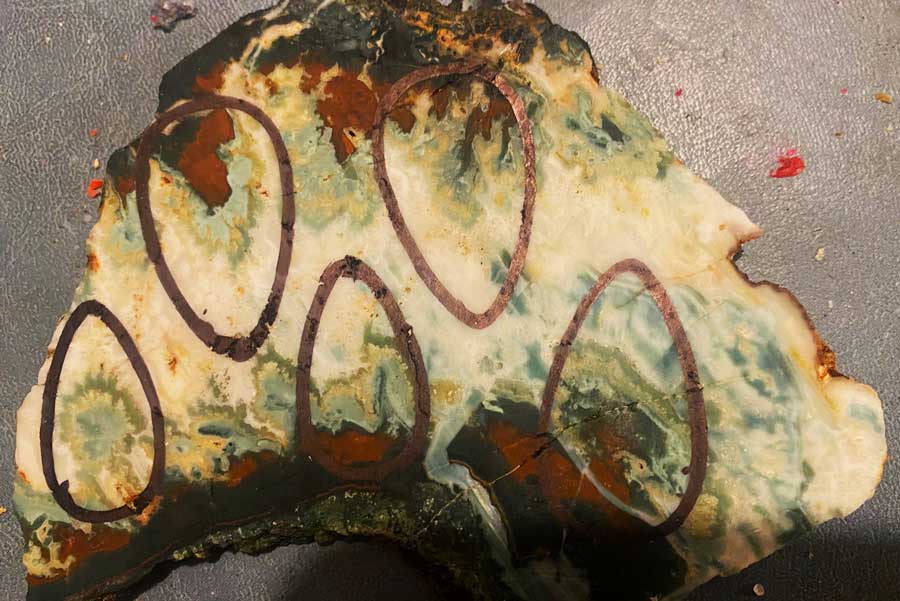 A slab of jasper/agate getting ready to make cabs for necklaces of "rock flowers."