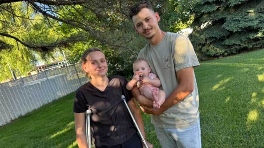 Bree Walton, left, and her husband, Gavon Walton, pose for a picture with their baby daughter after talking with KSL's Andrew Adams in West Haven, Utah, on Friday, June 12, 2026. Bree was injured the day before when a pickup truck veered off U.S. Highway 89 and crashed into the couple's house in Perry, Utah.