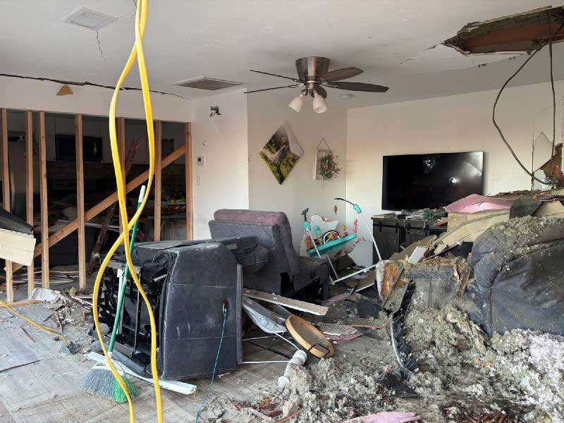 The damage left behind in the living room of a house in Perry, Utah, after a pickup truck crashed into it on Thursday, June 11, 2026.