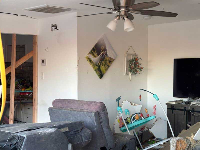 The damage left behind in the living room of a house in Perry, Utah, after a pickup truck crashed into it on Thursday, June 11, 2026.
