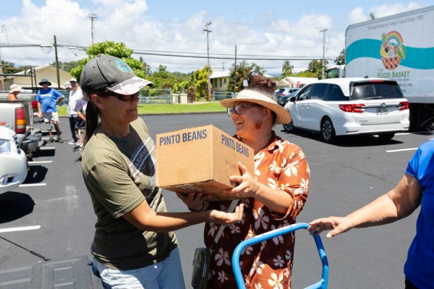 At a Church meetinghouse parking lot in Hilo, Hawaii, on June 13, 2026, nonprofit representatives, members, and friends of The Church of Jesus Christ of Latter-day Saints meet to organize a food donation from the Church as part of the America250 America Gives Initiative. Hawaii is the 50th state to receive a donation.