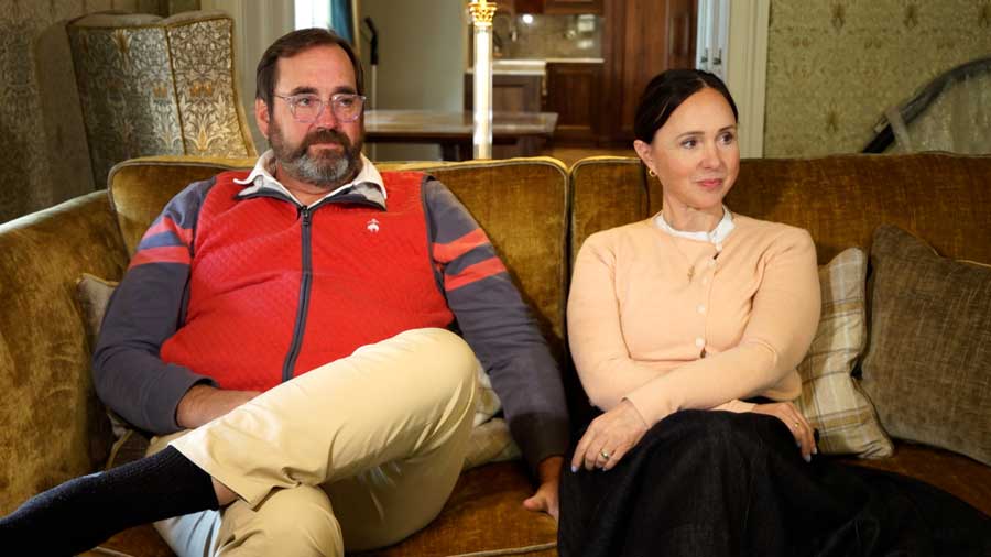 David Leavitt, left, and his wife, Chelom, sit for an interview with a KSL news crew inside their Scottish castle in 2026.