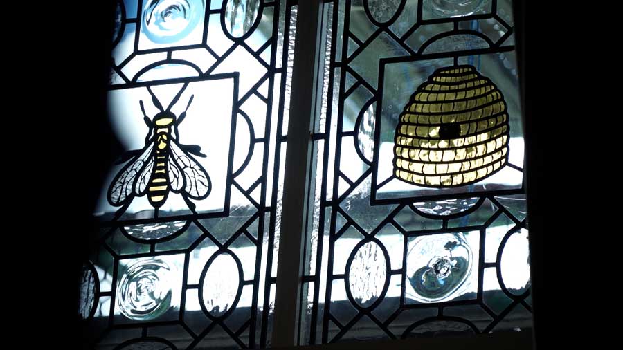 In renovating their Scottish castle, David and Chelom Leavitt have made sure to include little reminders of Utah, like this beehive on a stained-glass window.