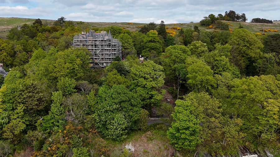 A distant view of the exterior of a Utah couple's castle in Cove, Scotland, as it undergoes renovations in 2026.