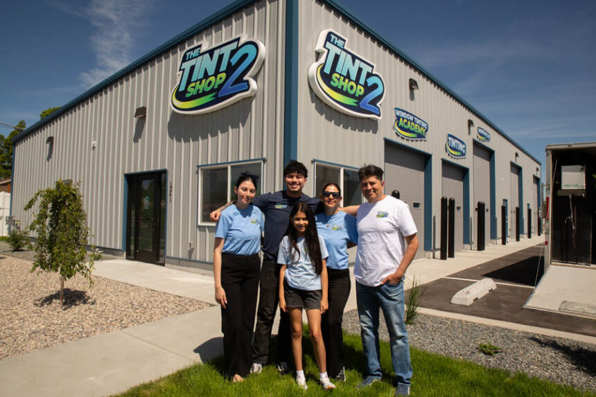 The Rodriguez family poses for a photo outside their window tinting shop. | Cody Roberts, EastIdahoNews.com