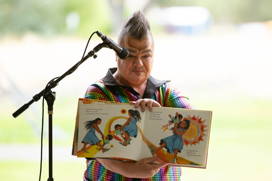 A drag performer reads "Freedom We Sing" to a crowd at Gate City Pride on Saturday. | Cody Roberts, EastIdahoNews.com