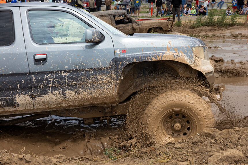 A truck drives through the mud bog at the Smith Group's annual Family Fun Fest. | Courtesy of the Smith Group