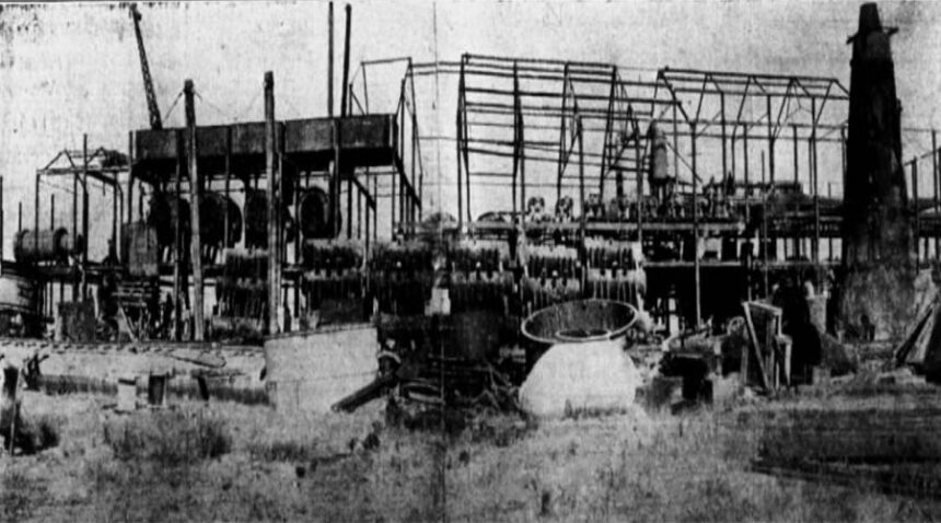 Sugar Factory at Burley with steel framework and heavier machinery in place and ready for erection of building. Conical structure on right is lime kiln in which lime for factory will be burned. Caption dated June 14, 1912.