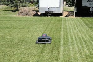 One of Whispr's robots mows a lawn. | Cody Roberts, EastIdahoNews.com