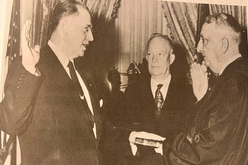 On January 21, 1953, Ezra Taft Benson, a member of the Quorum of the Twelve Apostles for the Church of Jesus Christ of Latter-day Saints, was sworn in as the U.S. Secretary of Agriculture. Supreme Court Justice Frederick M. Vinson administered the oath of office as President Eisenhower witnessed the proceeding. | Photo taken from the book "Presidents and Prophets" by Mike Winder