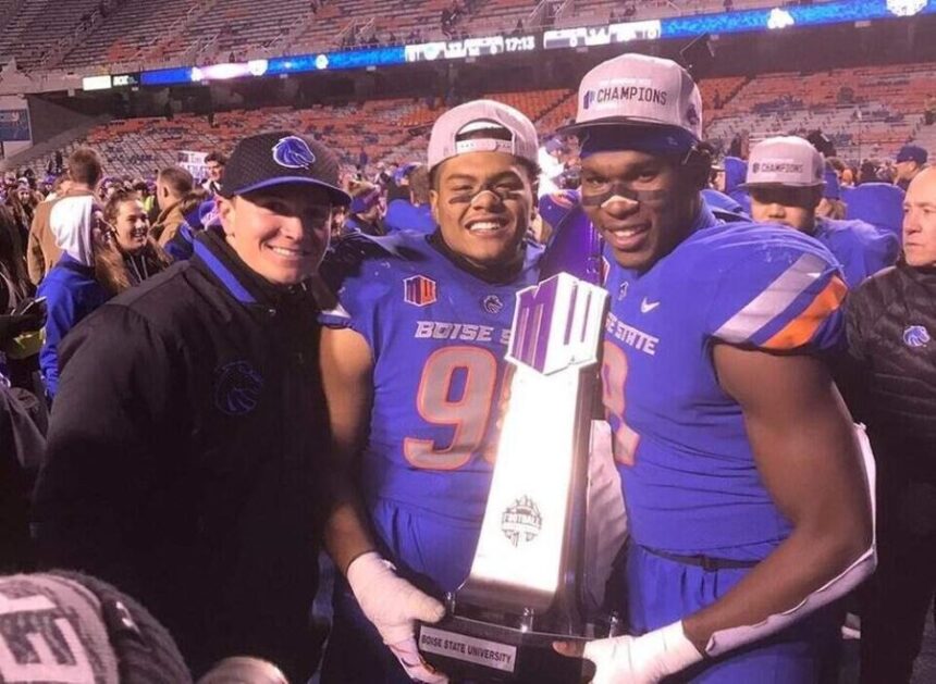 Then-graduate assistant Spencer Danielson, now the Boise State head coach, poses with Curtis Weaver and Jabril Frazier, right, after winning the Mountain West championship in 2017. Boise State