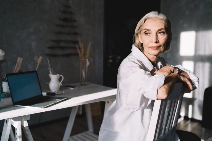 businesswoman sitting on chair at home art studio 2026 03 24 23 24 51 utc