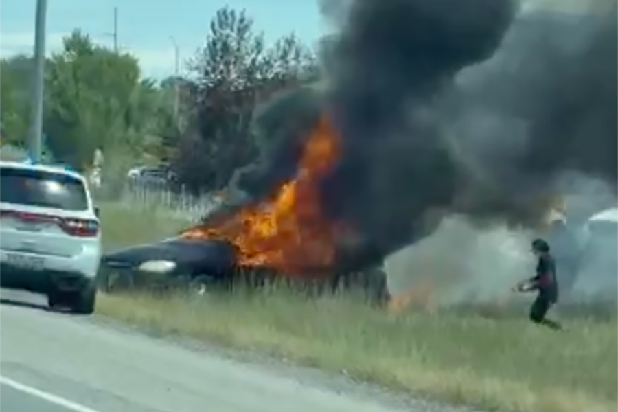 Large car fire spreads to nearby grass in Rigby, officials ask drivers to use caution