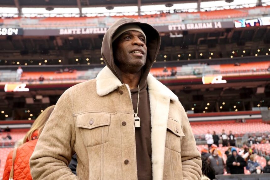 FILE - University of Colorado head coach Deion Sanders stands on the sidelines prior to the start of an NFL football game between the Cleveland Browns and the Tennessee Titans, Sunday, Dec. 7 2025, in Cleveland. (AP Photo/Kirk Irwin, File)